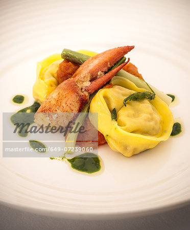 Still life with tortellini, crab and baby leeks