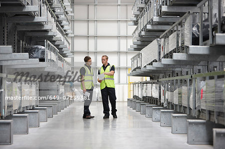 Warehouse workers in engineering warehouse