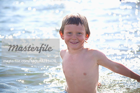 Portrait of boy in water, Wales, UK