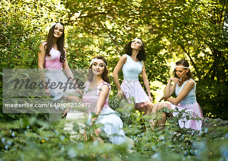 Portrait of four young ballet dancers in woods