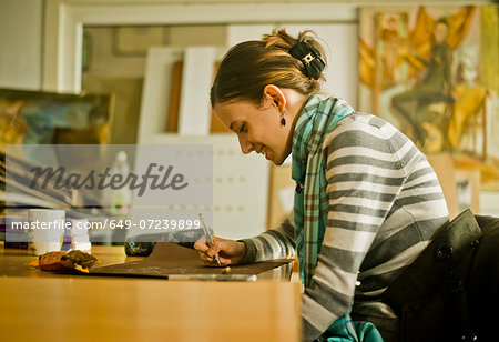 Young woman drawing picture