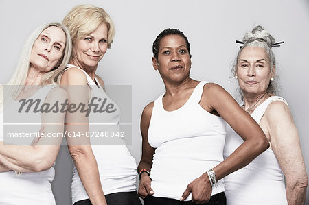 Studio portrait of senior women friends posing for camera Studio portrait of senior women friends posing for camera