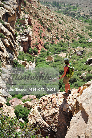 Female hiker standing on rock, Mount Wilson, Red Rock Canyon, Nevada, USA