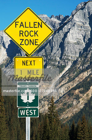 Close-up of sign on Trans Canada Highway with Rocky Mountains in background, near Revelstoke, BC, Canada