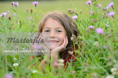 Girl lying in a meadow