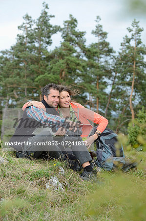 Couple taking a rest from their hiking tour