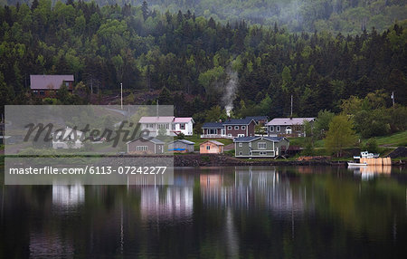 Houses along calm bay