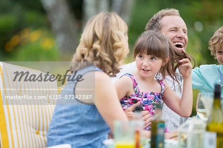 Family eating on patio