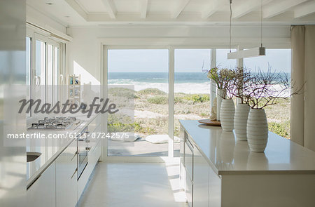 Modern white kitchen with ocean view