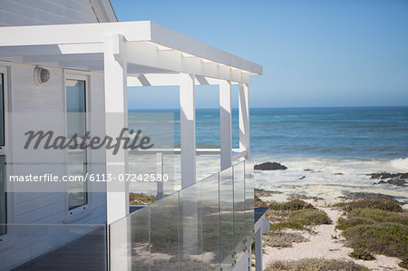 Beach house and balcony overlooking ocean