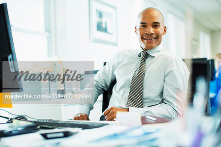 Businessman working at desk in office