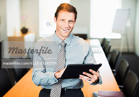 Businessman using digital tablet in office