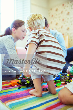 Father and children playing together