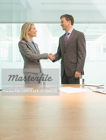 Business people shaking hands in meeting