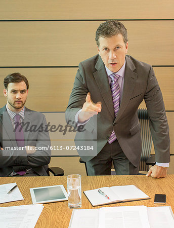 Businessman shaking his finger in meeting