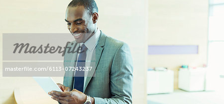 Businessman using digital tablet in office