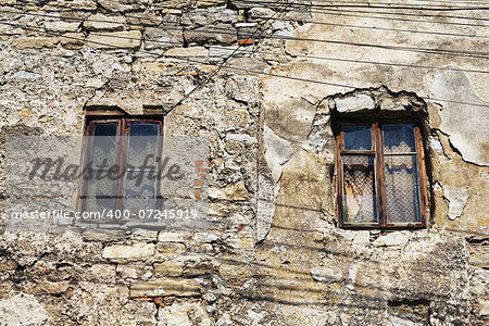 two window of abandoned house at day