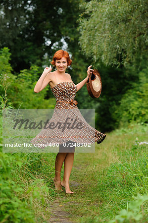 Portrait of the young beautiful woman outdoors