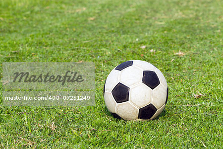 football (soccer) on green field