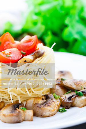 Pasta with fried mushrooms and cherry tomato
