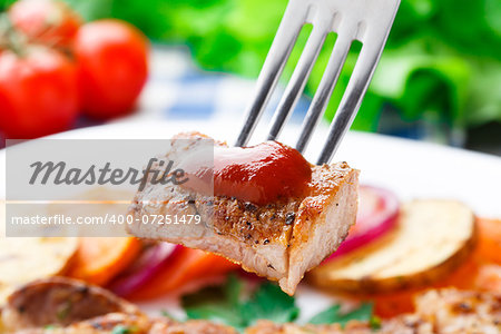 Piece of delicious steak on a fork