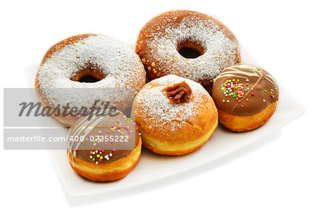 Festive donuts in different sizes. White background.