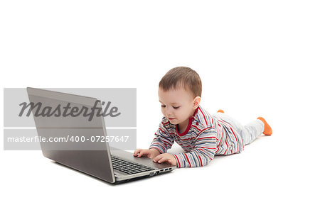 child pushing button on laptop isolated on white background