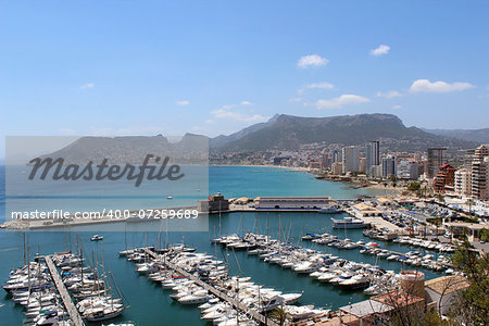 Panoramic view over Calp (Spain). Town bay beach