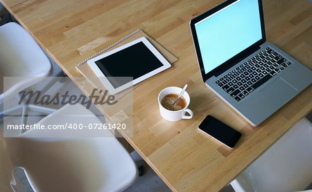laptop,ipad,coffee,mobile phone and notebook on table
