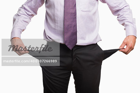 Mid section of a businessman with pockets pulled out over white background