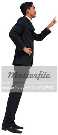 Unsmiling asian businessman pointing