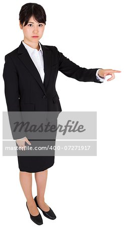 Focused asian businesswoman pointing