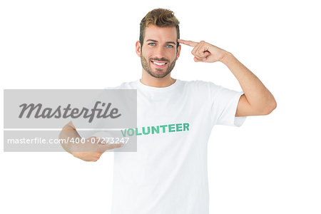 Portrait of a happy male volunteer pointing to himself over white background