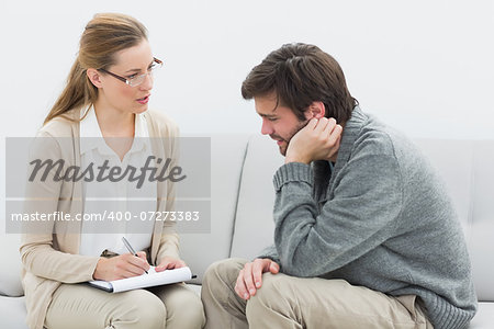 Young man in meeting with a financial adviser at home