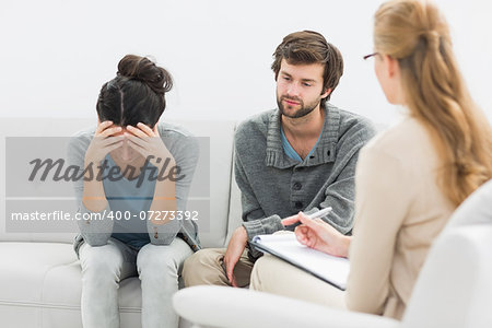 Young couple in meeting with a financial adviser at home