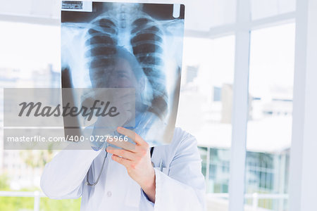 Closeup of a male doctor examining x-ray in the medical office