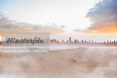 Sandy path leading to large urban city