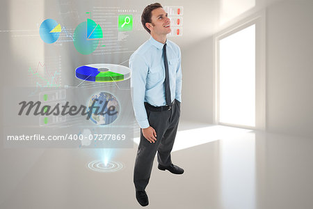 Happy businessman standing with hand in pocket against abstract blue design in futuristic structure