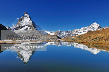 Matterhorn reflected in Lake Riffelsee, Zermatt, Alps, Valais, Switzerland Matterhorn reflected in Lake Riffelsee, Zermatt, Alps, Valais, Switzerland