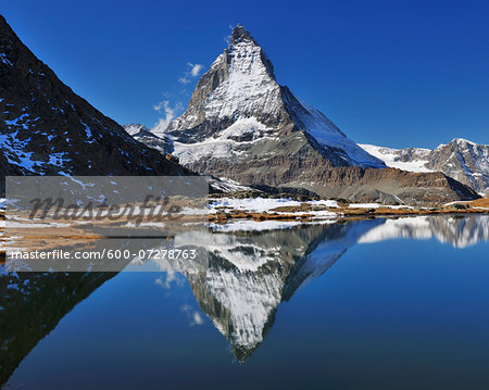 Matterhorn reflected in Lake Riffelsee, Zermatt, Alps, Valais, Switzerland