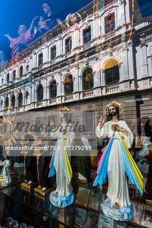 Reflection in Shop Window selling Religious Items, Quito, Ecuador
