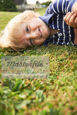 Young boy playing in garden