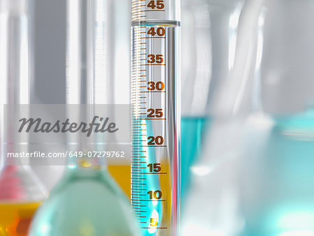 Laboratory glassware in lab, Measuring flasks and cylinders containing chemicals during experiment