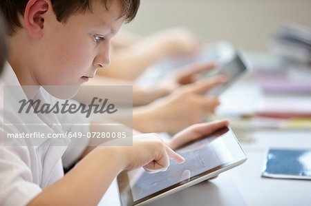 Close up of schoolchildren working in class