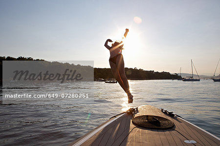 Woman diving from boat, Cannes Islands, Cote D'Azur, France