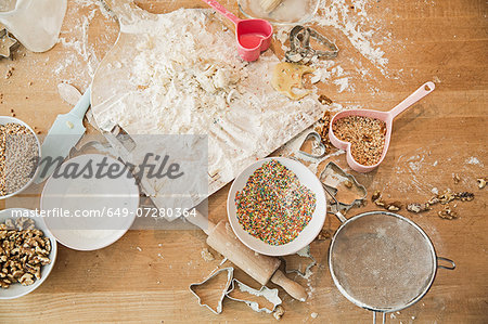 Ingredients, baking mold, bowls, rolling pin, sieve