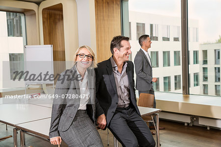 Businesspeople sitting on conference table