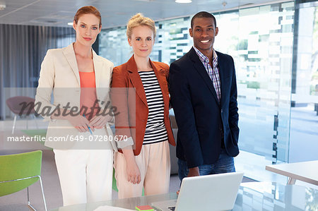 Businesspeople standing in office