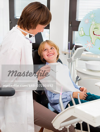 Boy in dentists chair at check up