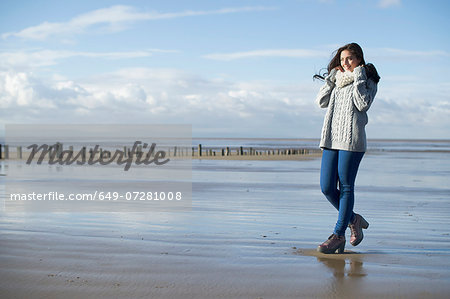 Young woman on beach, Brean Sands, Somerset, England